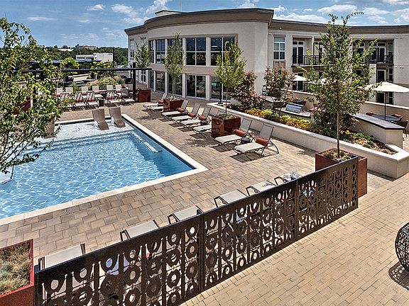 Rooftop pool with expansive sundeck and views of Uptown Charlotte