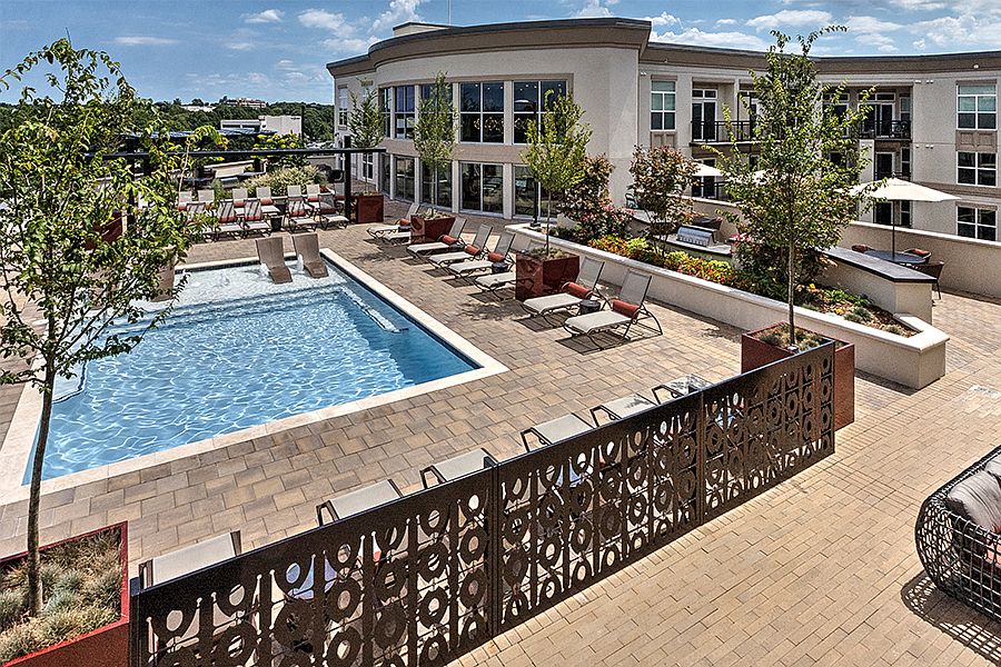 Rooftop pool with expansive sundeck and views of Uptown Charlotte