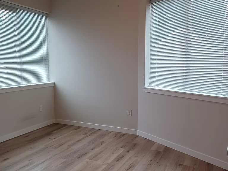 Bedroom 2 similar without the sloped ceiling shown. 9' flat ceiling in unit, updated pictures next week.