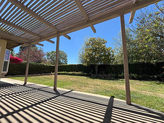 Large patio with morning shade and afternoon sun.