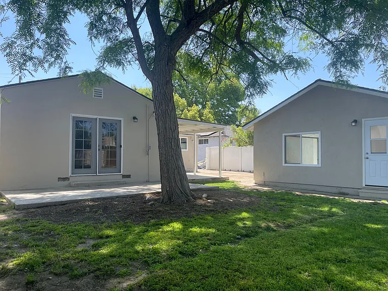 Large backyard with two patio areas. Great for pets and entertaining.

Detached garage with door access, lots of natural light and Air Conditioning.
