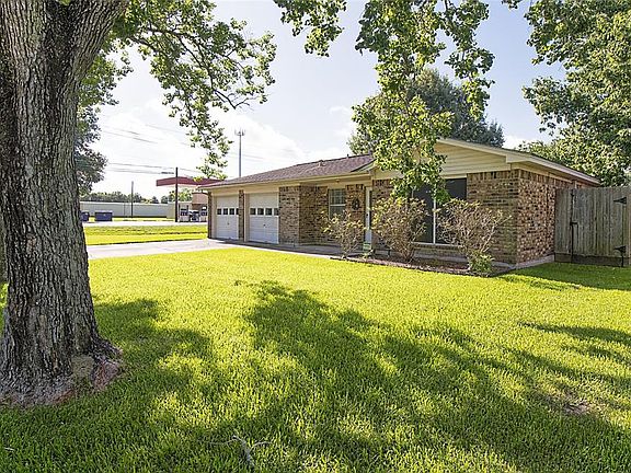 Beautiful trees adorn the front yard, providing much needed shade during the Summer months.
