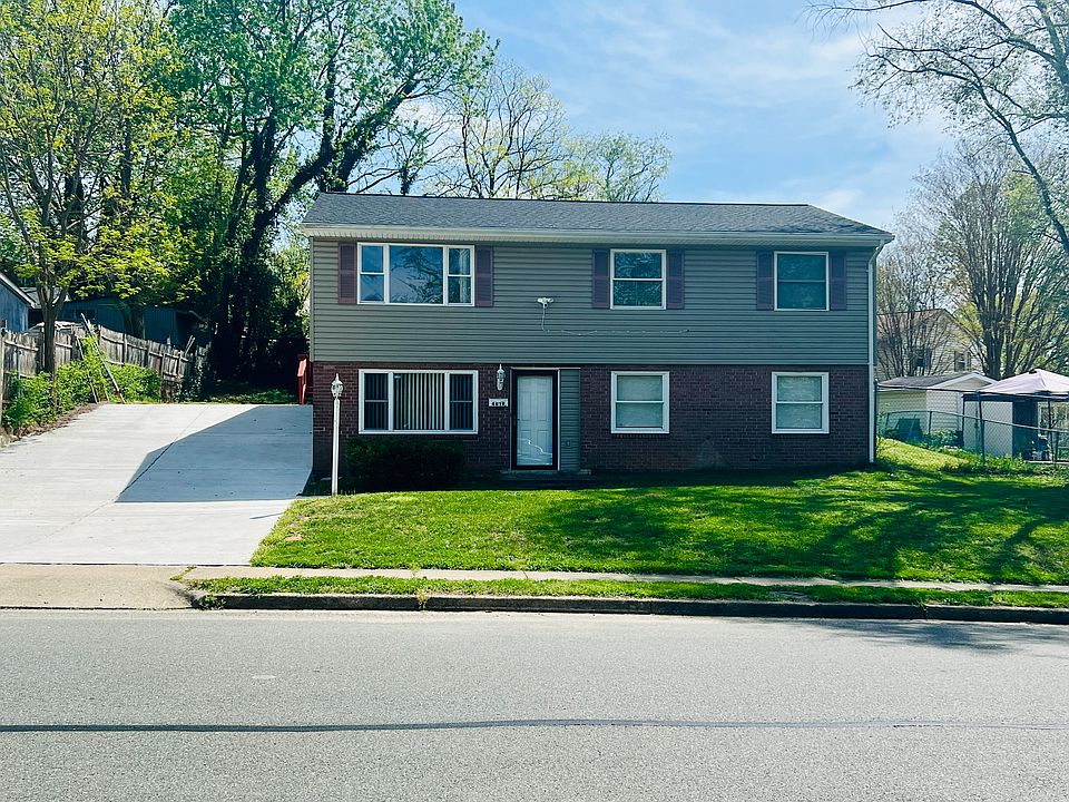 Detached single family home with spacious backyard and extended driveway.