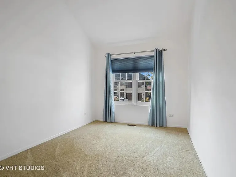 2nd bedroom which is on main floor away from the great room, hardwood floors have replaced carpeting.