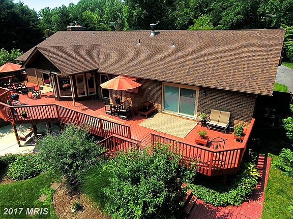 Dining and Grilling Deck Surveying Lush Acreage