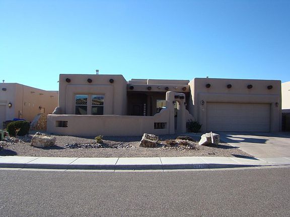 Front courtyard, southwestern landscape. New roof and the stucco was just refinshed.
