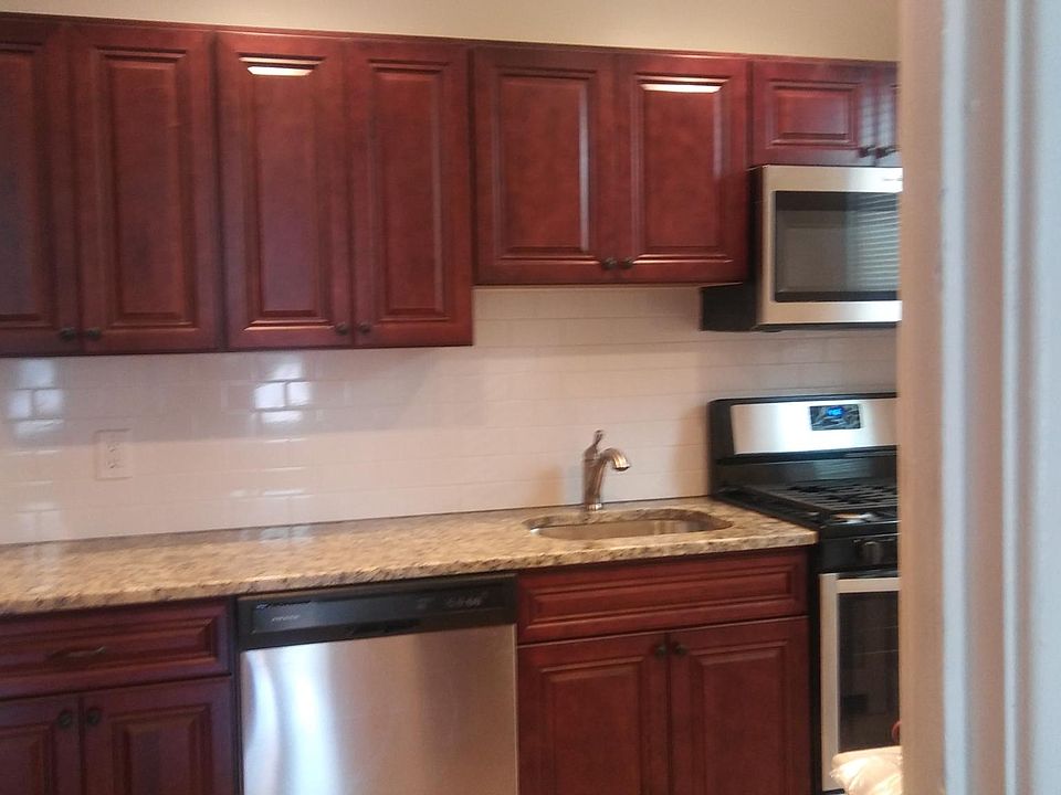 Brand New Kitchen with granite countertop, ceramic tile floo