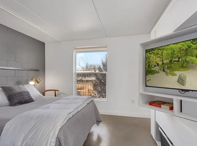 Bedroom with built-in TV turntable and shelves Bedroom with built-in TV turntable and shelves