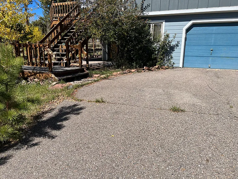 Garage door next to deck and paver patio!