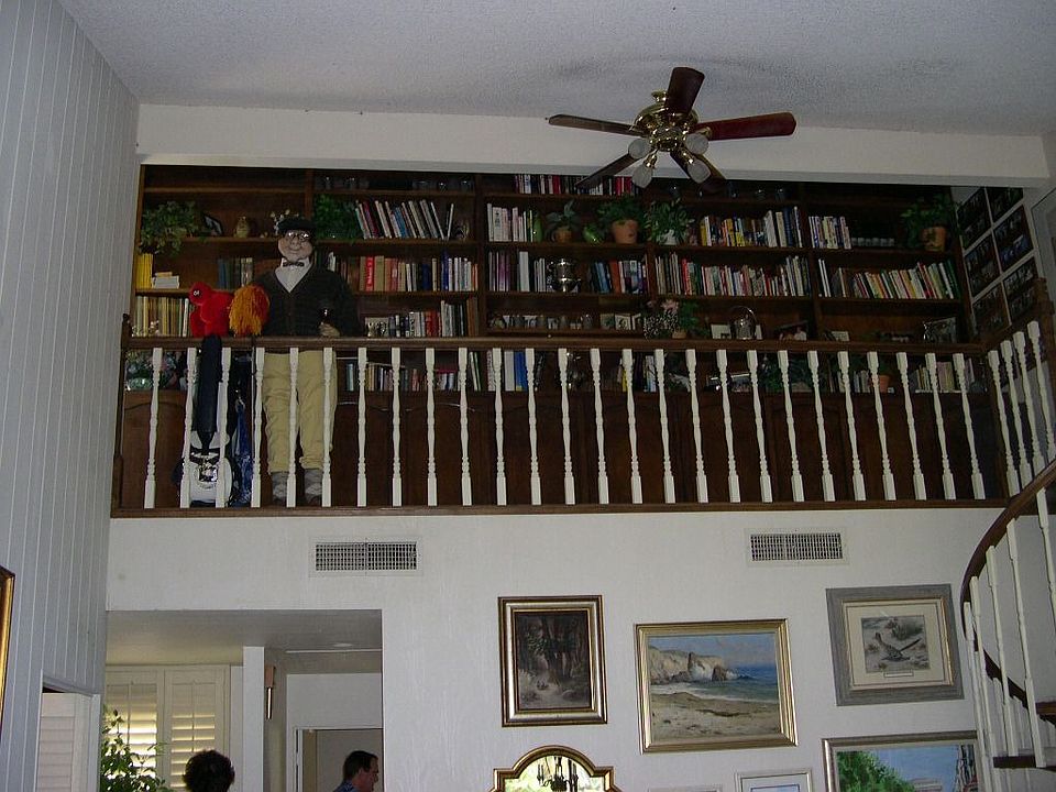 Pocket Library and wine storage above the living room