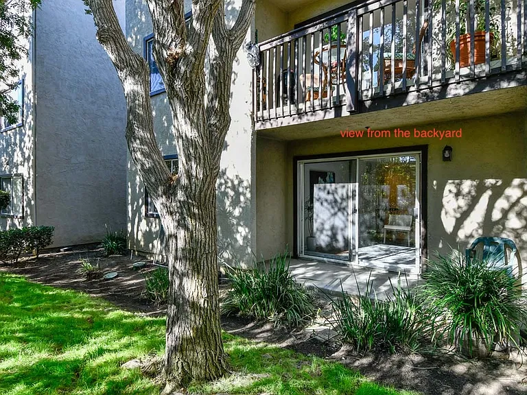View of private patio from woody common yard
