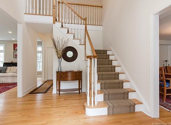 Welcoming foyer is elegant and sun-filled.