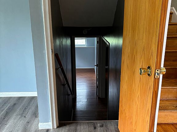 Stairs leading to full bath/family room that could be used as 5 bedroom/master bedroom and a smaller 4 bedroom downstairs.
