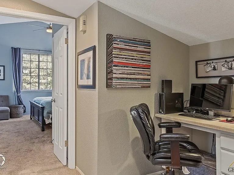 Small office den/style from the main upstairs entrance leading to all bedrooms.
