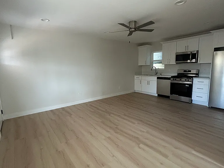 Large living room -- view into amazing spacious kitchen
