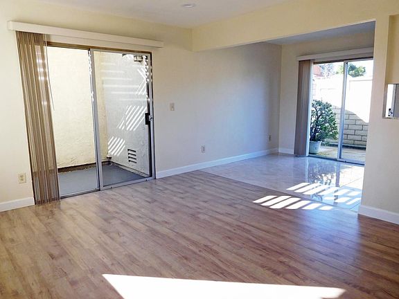 Completely remodeled end unit, earth tone laminate wood floo