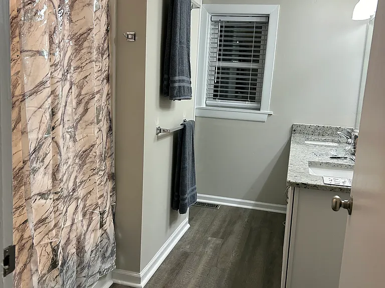 Double vanity sinks with water closet for privacy