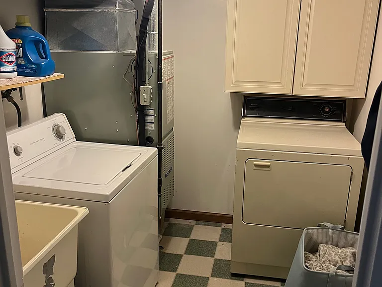 Laundry Room with a washer and dryer, and a utility sink.