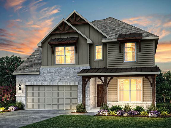 Exterior K with wood shutters, stone accents, and 2-car garage with additional storage