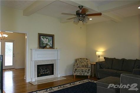 Enjoy entertaining or quiet times in the Great Room featuring woodflooring & fireplace with gas logs