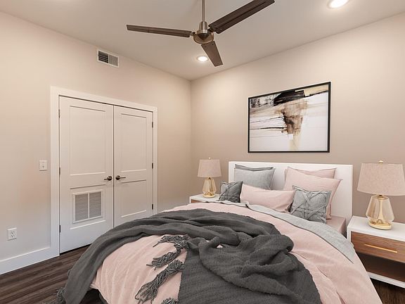Primary bedroom shown with a queen bed.