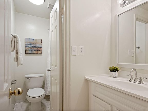 Bathroom with separate vanity area, linen closet