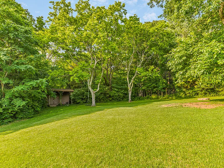 Huge backyard with a trampoline and a treehouse!