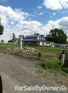 South view of house
						:
						View shows Hot tub and south side of house