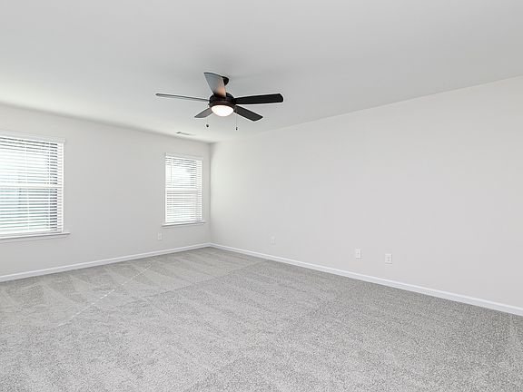 Rest and relaxation await in the master bedroom