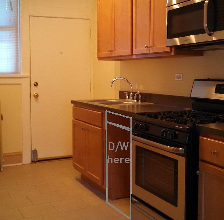 Kitchen with stainless appliance including d/w and hood microwave