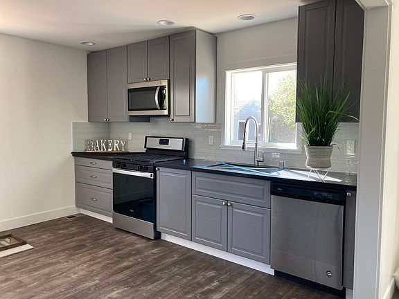 New kitchen with sleek granite countertop