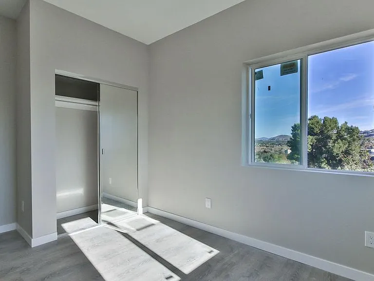 Upstairs bedroom facing mountains and backyard