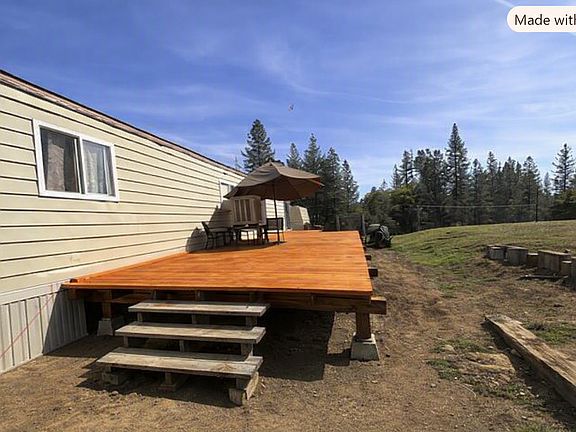 Large deck to enjoy sitting outdoors and enjoying the sounds of nature.