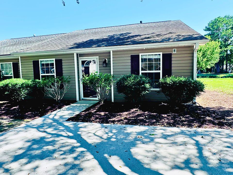 Front of the townhome from the shaded driveway.