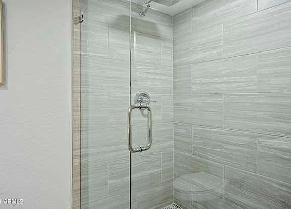 Large, walk in shower with beautiful glass shower enclosure