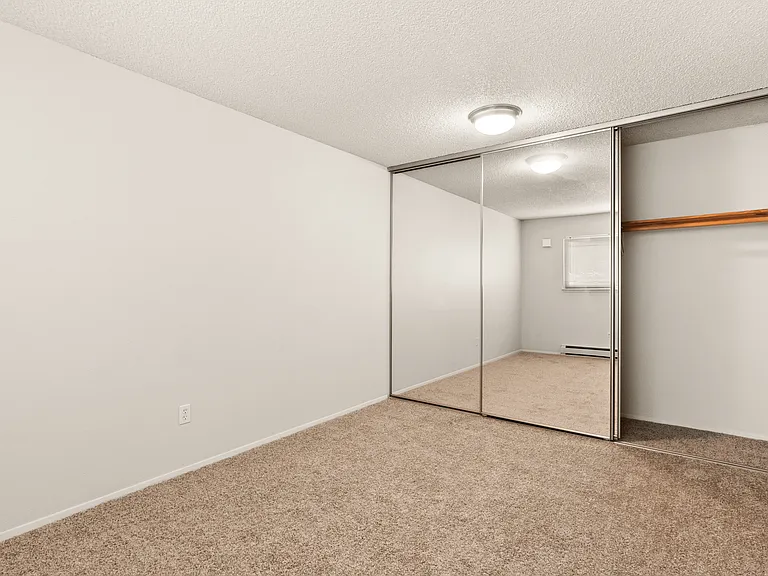 Unwind in this bright and spacious bedroom, featuring ample closet space and cozy carpeting. Unwind in this bright and spacious bedroom, featuring ample closet space and cozy carpeting.