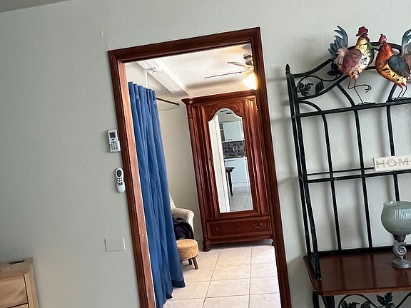 Doorway between Living area and bedroom. Pocket door open.