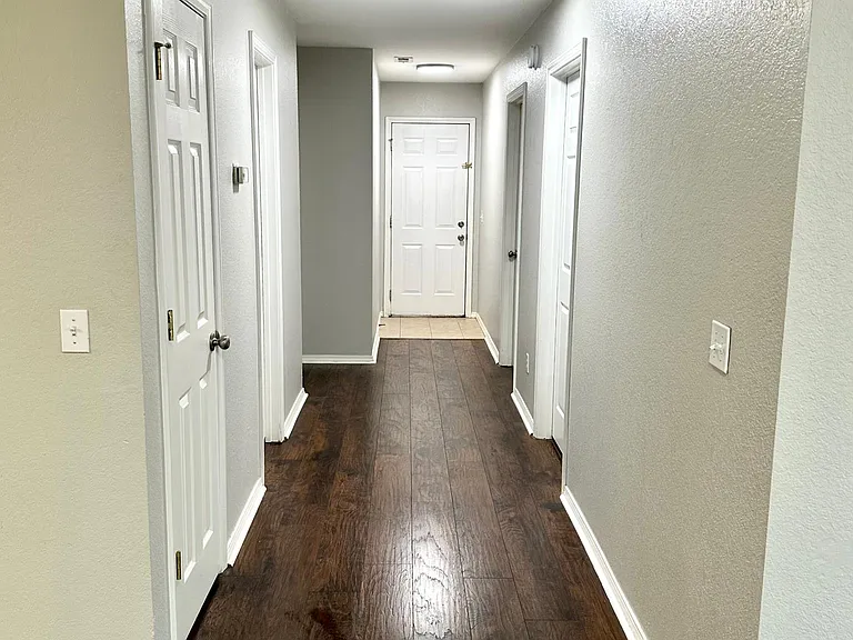 Central hallway with storage/towel closet.