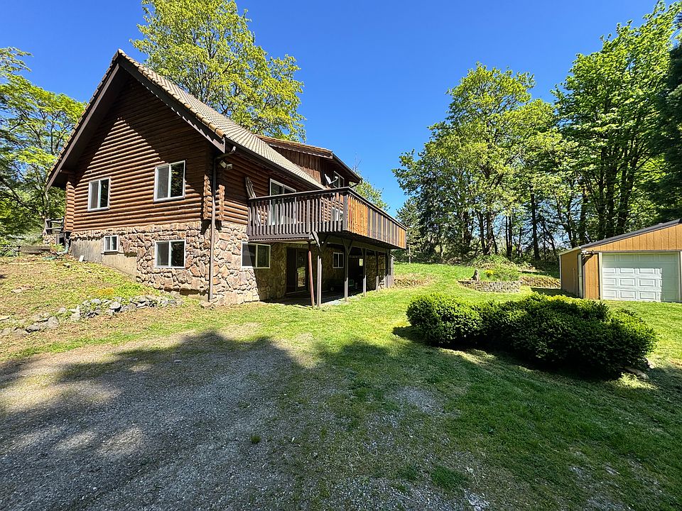 Updated bottom floor unit with 1 car garage on 27 Acres with gated entry! **Top floor is a separate unit**