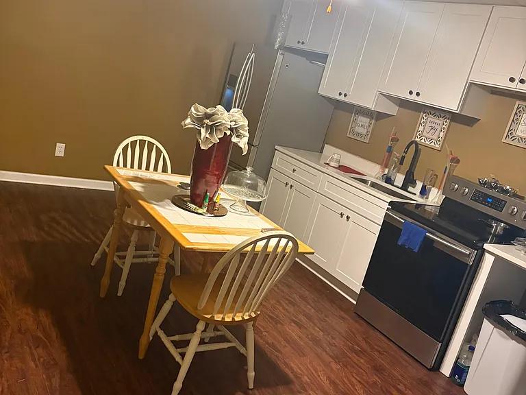 Refrigerator is in the corner in the kitchen also has ice maker