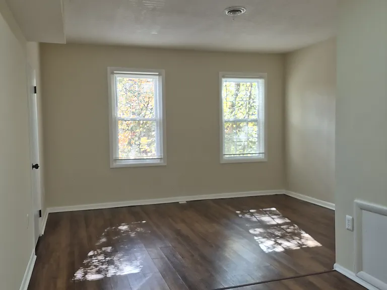 Living room faces front of the building bringing natural light throughout the day.