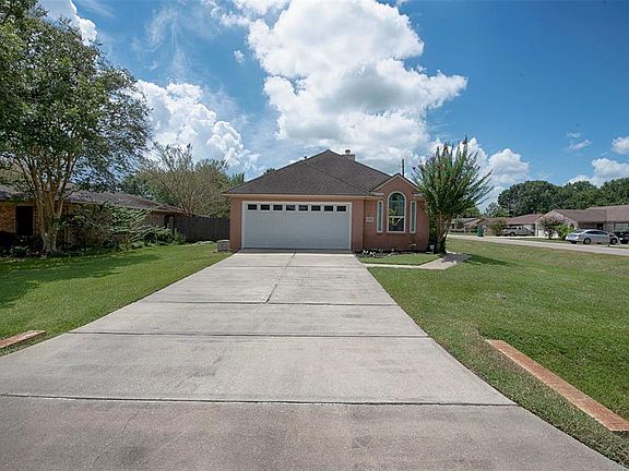A double wide driveway from Meadowville leads to a 2-car garage.