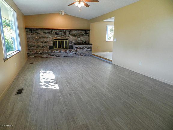 Living Room with Brick gas fireplace