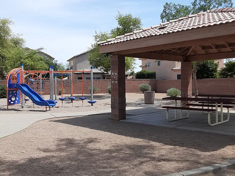 community playground in the park located just behind the house