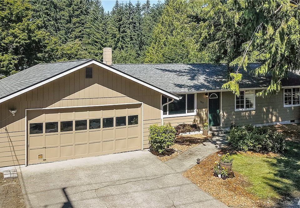 Plenty of parking and low maintenance front yard (garage door recently painted white).