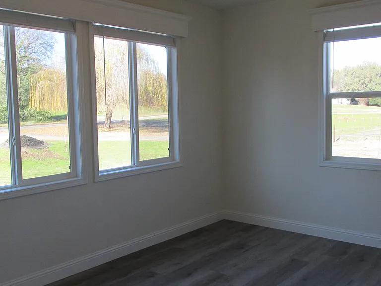 Master bedroom with ceiling fan.