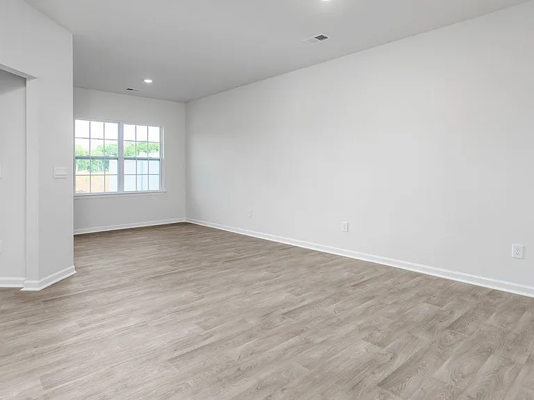Living/dining room space without furniture.

Photo cred: DR Horton