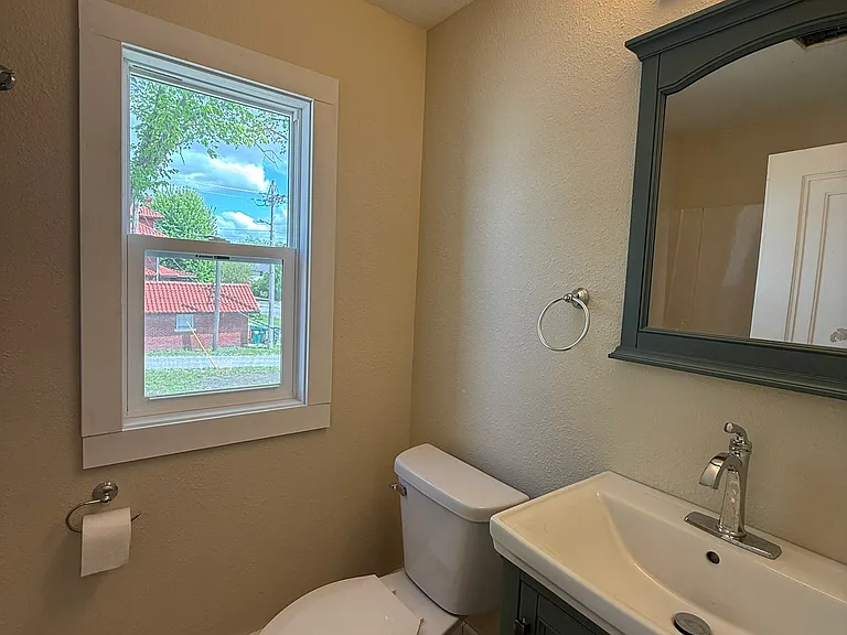 Upstairs updated bathroom with tub/shower combo.