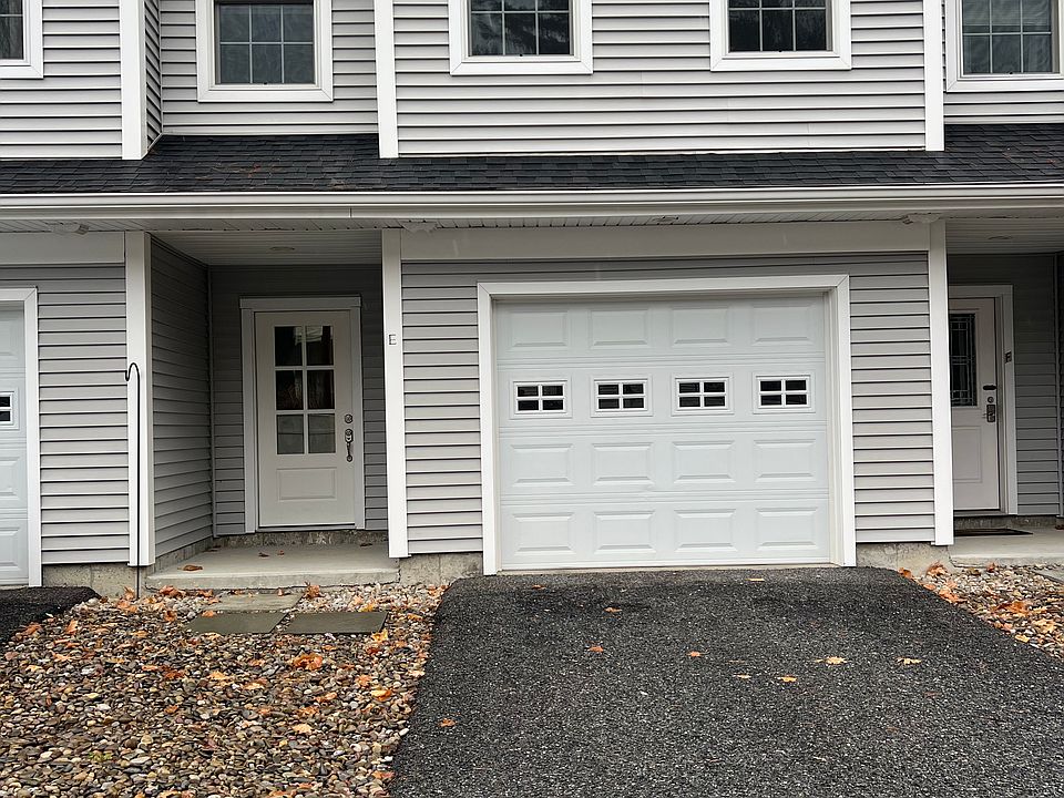 Back entrance and garage from private roadway.