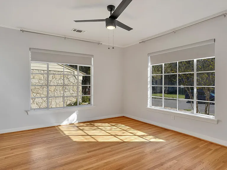 Front bedroom with a ceiling fan.